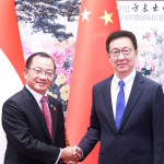 Chinese Vice President Han Zheng (R) shakes hands with Seah Kian Peng, speaker of the Parliament of Singapore, in Beijing, China, June 12, 2026. /Xinhua
